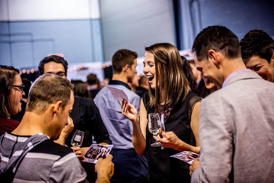 Trade show crowd engaging with photo booth prints